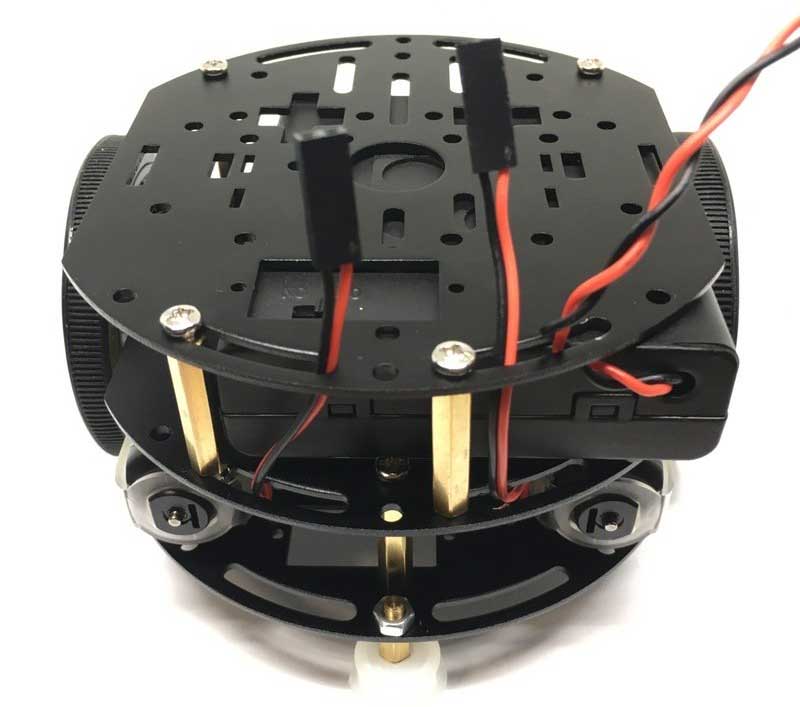 Route the wires from the motors and the battery box